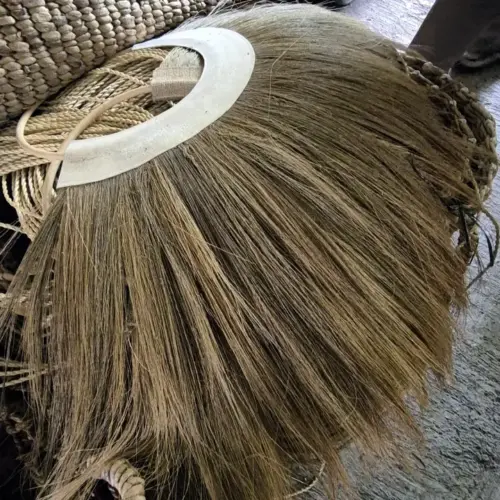 Bundles of raw Rayung grass, a natural fiber sourced sustainably in Indonesia, used by PT. Mitra Eco Bhavana for handcrafted woven products.